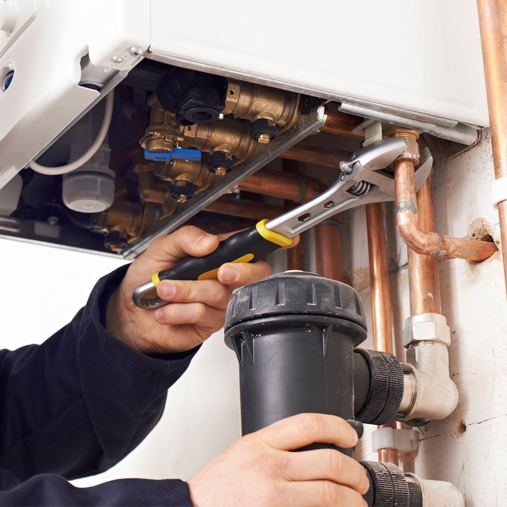 Close-up of boiler components being inspected during a boiler repair colorado