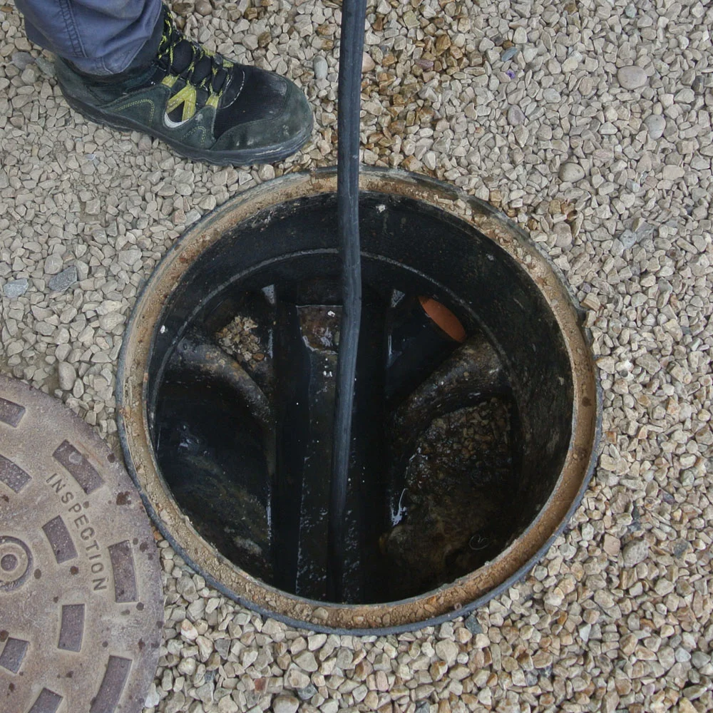Clogged drain being cleared by trusted plumber in Colorado